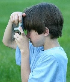 Boy holding camera